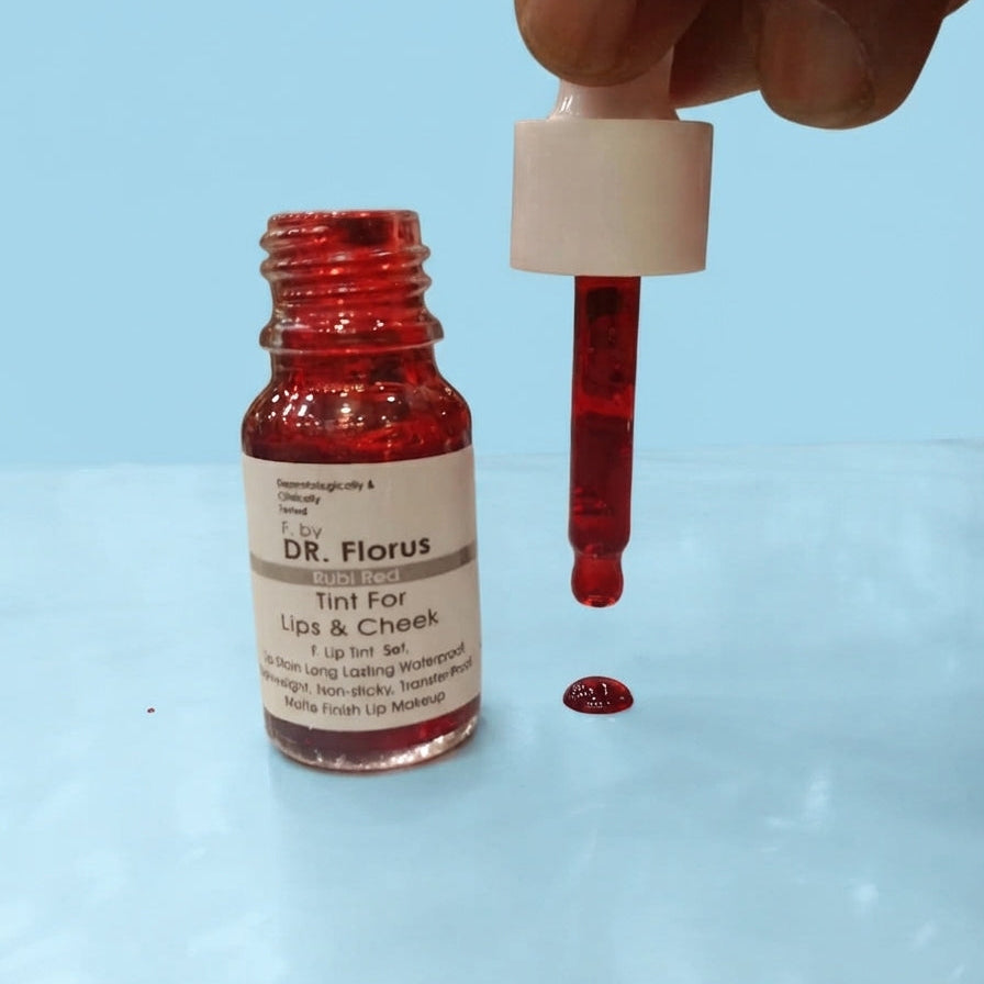 DR. Florus Lip and Cheek Tint bottle in Rubi Red shade with dropper showing a drop of red liquid