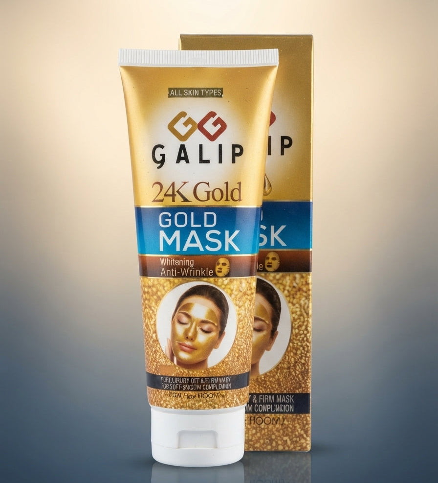 A tube of GALIP 24K Gold Gold Mask standing in front of its matching product box on a reflective surface against a warm gradient background.