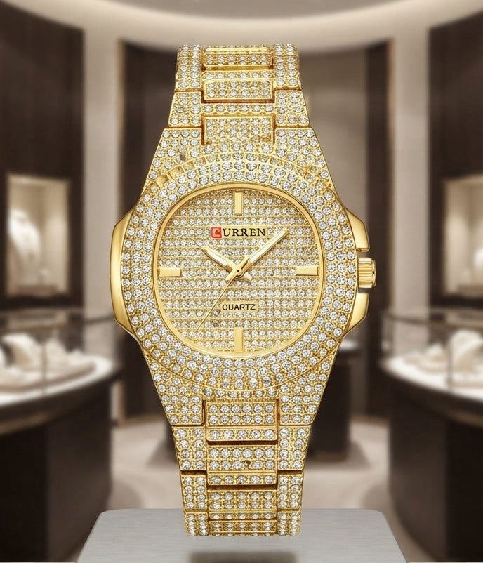 A luxury gold-tone wristwatch encrusted with diamonds, displayed on a silver and wood pedestal in a high-end boutique setting.