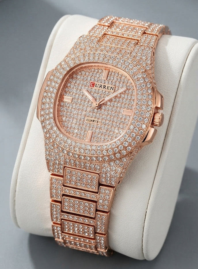 A luxury rose gold watch encrusted with diamonds, displayed on a white cylindrical stand against a gray background.