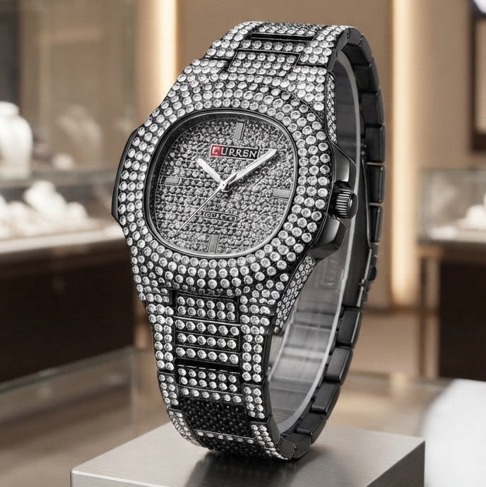 A luxury watch with a diamond-encrusted silver-tone case and matching bracelet, displayed on a metallic pedestal inside a high-end boutique.