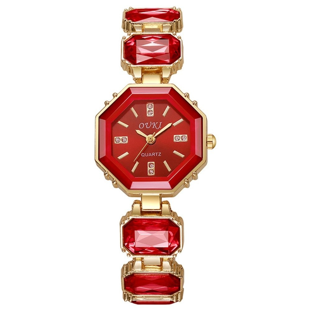 A women's octagonal quartz watch by OUKI, featuring a red gemstone bezel and bracelet with gold-tone case and matching red and gold dial.