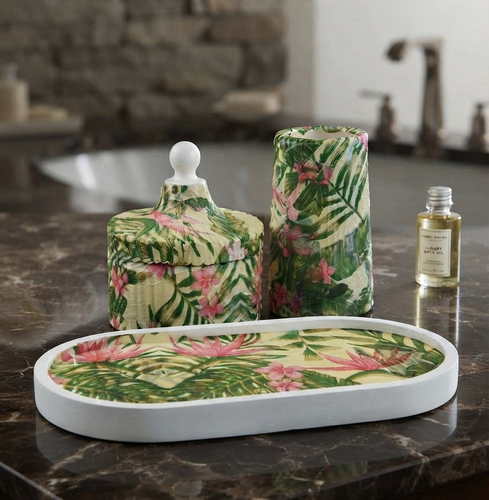 A Zeeno Place luxury ceramic bathroom organizer set with tropical green and pink floral prints displayed on a marble countertop.