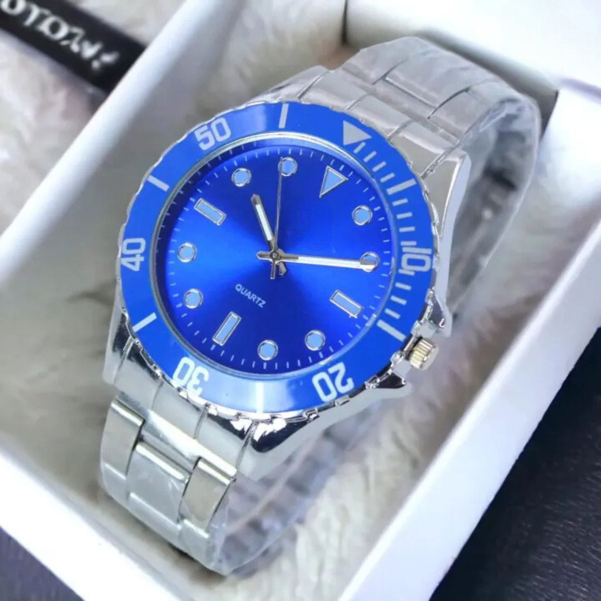 Silver stainless steel wristwatch with a striking blue dial and bezel