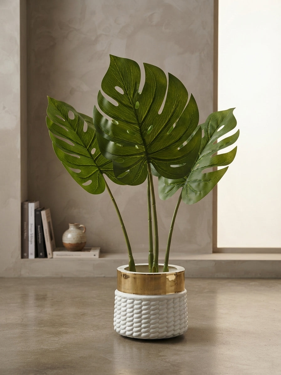Monstera artificial plant in a white and gold textured pot for modern home decor