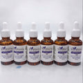 Multiple amber glass bottles of Skine Whitening Lush Bright Skin 5X Serum with white droppers