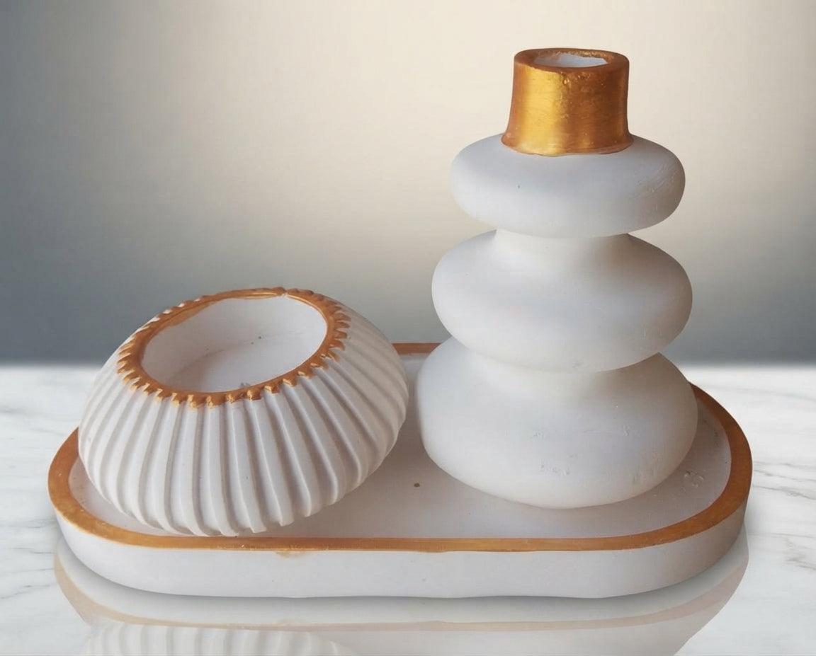 A white ceramic holder set with a tiered tree-shaped holder and a ribbed bowl lid, both accented with gold trim, displayed on a matching tray.