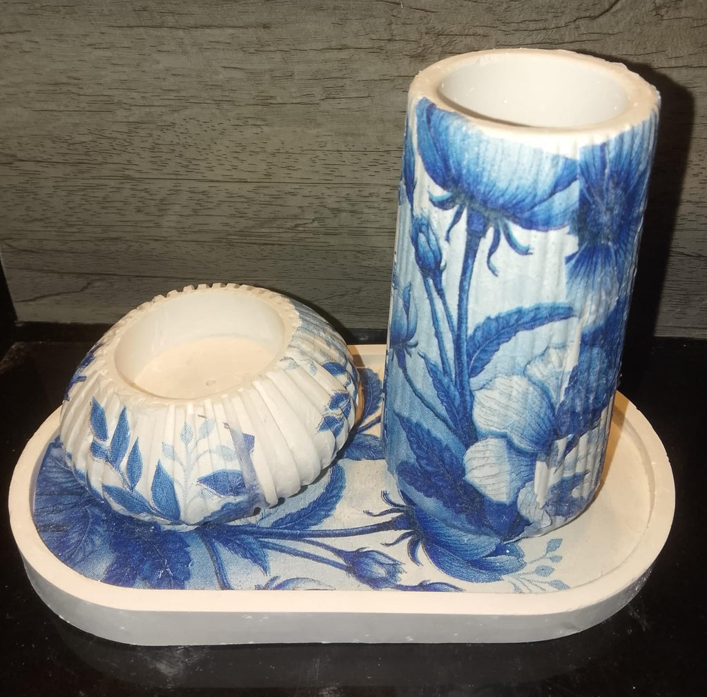 Close up view of artistic ceramic vase with blue and pink floral decoupage print