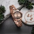 RELO rose gold watch with chunky chain link bracelet and textured dial styled on marble surface. 